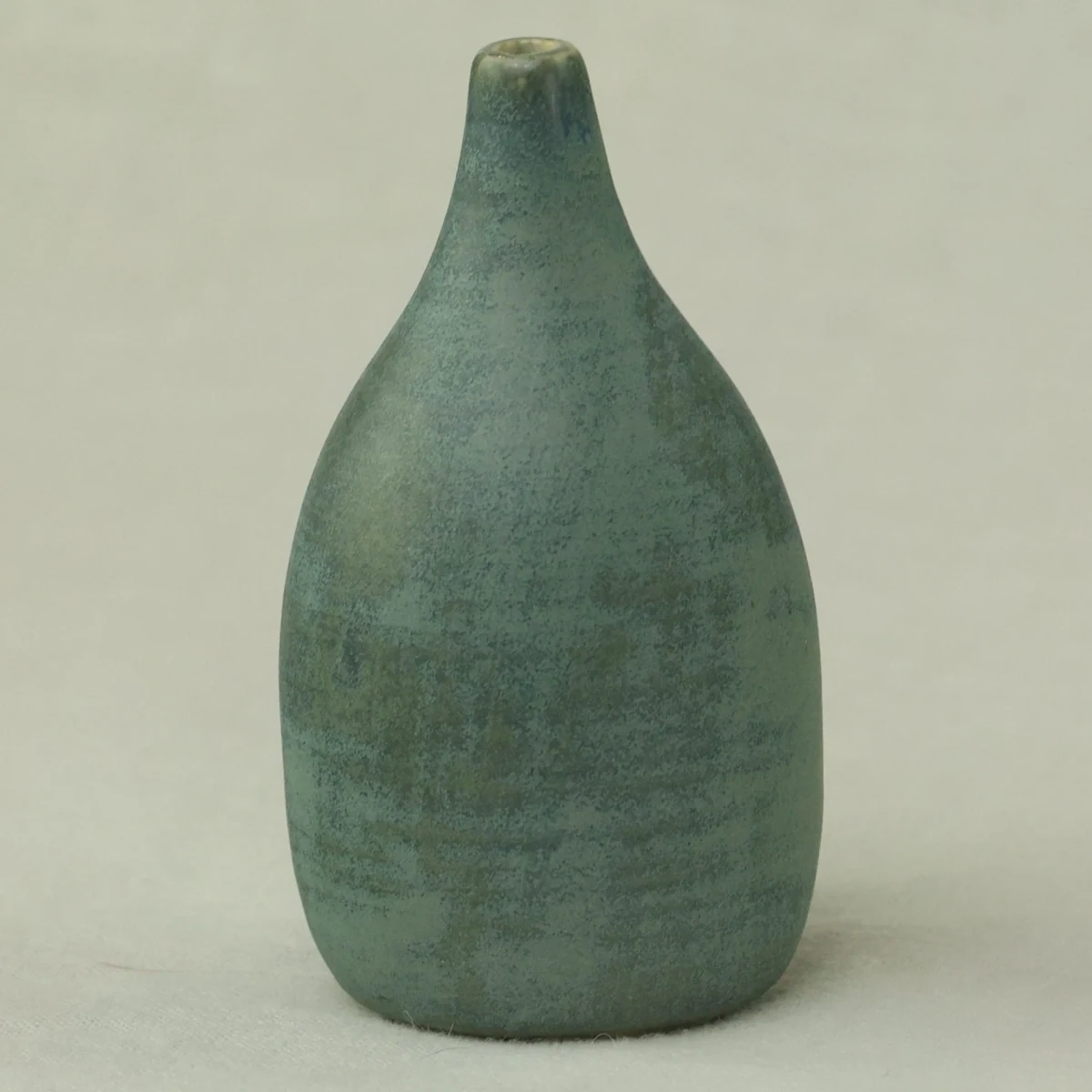 Teal-glazed bottle vase